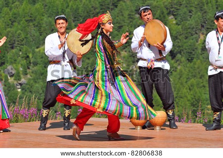 EVOLENE, SWITZERLAND - AUGUST 11: Uzbeki dance troupe at the International Festival of Folklore and Dance from the mountains (CIME): August 11, 2011 in Evolene Switzerland