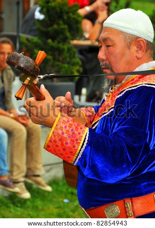 EVOLENE, SWITZERLAND - AUGUST 15: Buryat singer at the International Festival of Folklore and Dance from the mountains (CIME) : August 15, 2011 in Evolene Switzerland