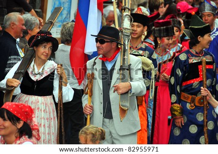 EVOLENE, SWITZERLAND - AUGUST 15: Skiers from the past at the International Festival of Folklore and Dance from the mountains (CIME) : August 15, 2011 in Evolene Switzerland