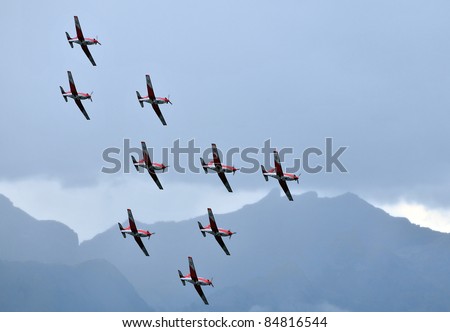 SION, SWITZERLAND - SEPTEMBER 17: Swiss air force PC-7 team in formation at the Breitling Air show.  September 17, 2011 in Sion, Switzerland