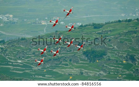 SION, SWITZERLAND - SEPTEMBER 17:  Swiss Air force PC-7 team manouvering at the Breitling Air show.  September 17, 2011 in Sion, Switzerland