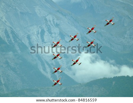 SION, SWITZERLAND - SEPTEMBER 17:  Swiss Air force PC-7 team in the mountains at the Breitling Air show.  September 17, 2011 in Sion, Switzerland