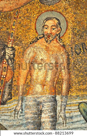 The magnificent mosaic of the baptism of Jesus Christ in the river Jordan. From the UNESCO listed Neonian  baptistry ceiling, Ravenna, Italy