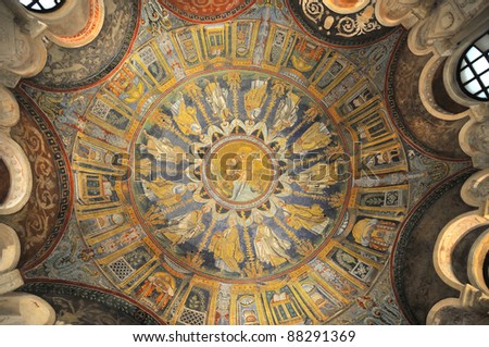 Jesus Christ being baptised by John the baptist and around him the 12 apostles. The magnificent domed, UNESCO listed roof of the neonian baptistry, Ravenna, Italy