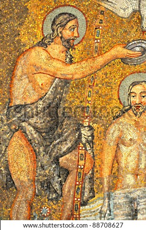 Magnificent ancient roman mosaic of John the Baptist baptising Jesus Christ from the UNESCO listed  Neonian baptistry, Ravenna, Italy