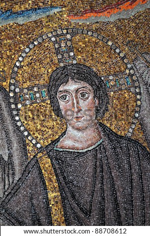 ancient Byzantine mosaic of Jesus Christ shown without beard and appearing youthful to counter the Aryan schism. From the UNESCO listed basilica of St Vitalis, Ravenna, Italy