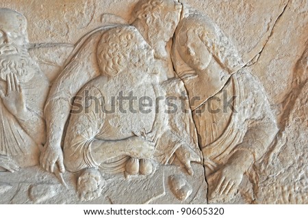bags of gold in the hands of Judas during the last supper.  Byzantine sculpture in marble