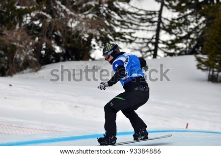 VEYSONNAZ, SWITZERLAND - JANUARY 22: World Champion Nate Holland (USA) in the  FIS World Championship Snowboard Cross finals : January 22, 2012 in Veysonnaz Switzerland
