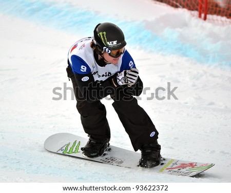 VEYSONNAZ, SWITZERLAND - JANUARY 21: World Champion Nate Holland (USA) competes at the FIS World Championship Snowboard Cross finals on January 21, 2012 in Veysonnaz, Switzerland