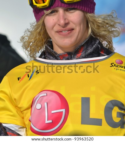VEYSONNAZ, SWITZERLAND - JANUARY 22: World Champion Lindsay Jacobellis (USA) at the FIS World Championship Snowboard Cross finals on January 22, 2012 in Veysonnaz, Switzerland