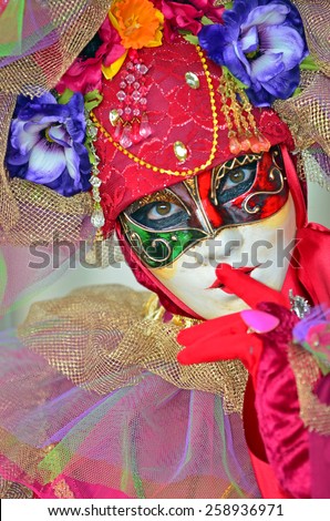 VENICE, ITALY - FEBRUARY 12: Beautiful Carnival masked lady with finger to her lips at the 2015 Venice Carnival:  February  12, 2015 in Venice, Italy