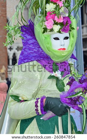 VENICE, ITALY - FEBRUARY 12: Carnival masked costume with a garden theme at the 2015 Venice Carnival:  February  12, 2015 in Venice, Italy