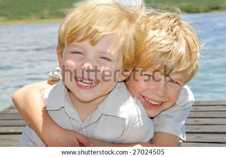 Happy young brothers hugging