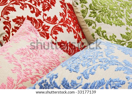 Combination of different colored and patterned pillows