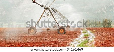 Modern irrigation system watering a farm field