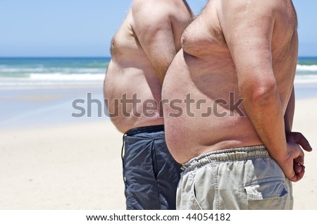 Two obesely fat men showing their bellies on the beach