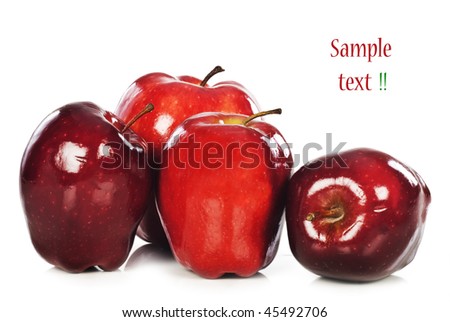 Four healthy vibrant red apples on a white background with space for text