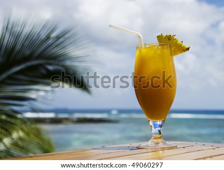 a Fresh healthy fruit cocktail drink on a tropical island