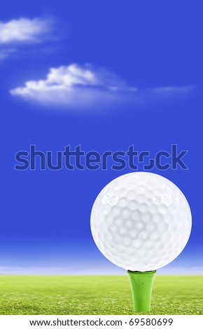 Golf ball on a green peg with golf course and sky in the background