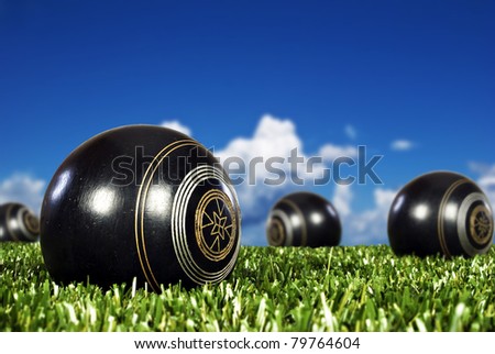 Close up of  bowling balls on an open bowling field