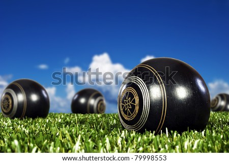 Close up of bowling balls on an open bowling field