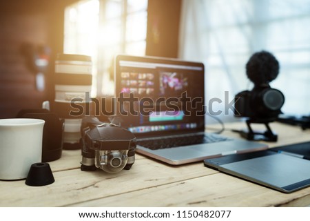The accessories gear for Youtuber creative and Vlogger editor in house office the laptop Lens Camera and Drone And for editing video upload to internet.