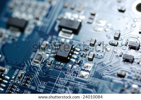 Close up photo of blue PC circuit board. Technology background.