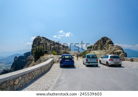METEORS, GREECE - AUGUST 11, 2014: Unidentified people go from the car park to the viewing platform in Meteors, Greece