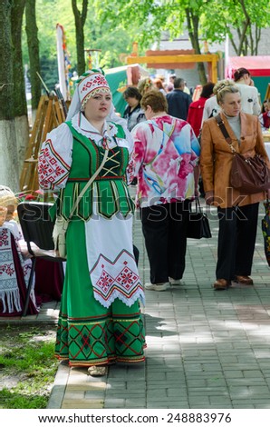 GOMEL, BELARUS - MAY 16, 2014: Outdoor events City Wizards. Woman in Belorussian suit