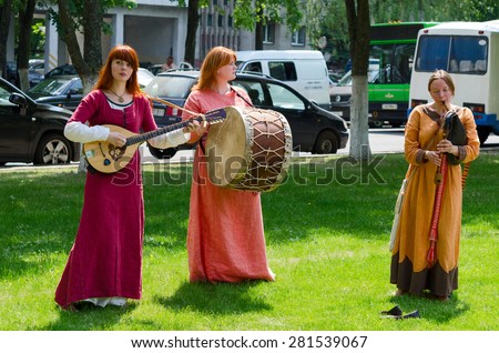 GOMEL, BELARUS - MAY 22, 2015: Outdoor event City of Masters. Speech by the ensemble with ancient folk musical instruments