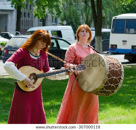 GOMEL, BELARUS - MAY 22, 2015: Outdoor events City of Masters. Speech of amateur ensemble with ancient folk musical instruments
