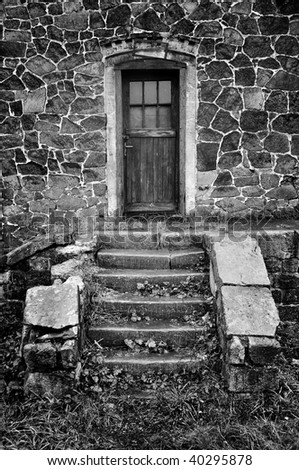 Old stone stairs, wall and door