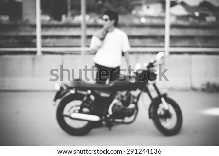 Vintage biker blurred background - black and white