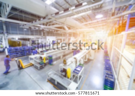 Abstract blur people in factory room for background, blurred background for industry. blurred background image of Warehouse. blurred background light