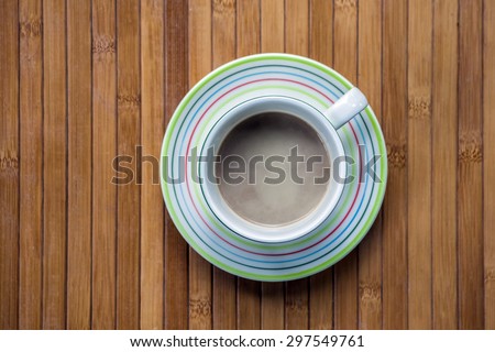 coffee cup on bamboo plate