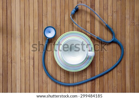empty coffee cup and stethoscope, relaxing concept for doctor