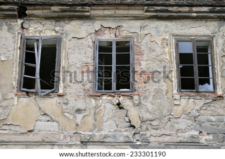 View to the window  /   View to the broken windows in a small Czech village