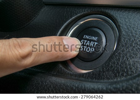 Car driver starting the engine