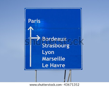 Road sign with different cities in France