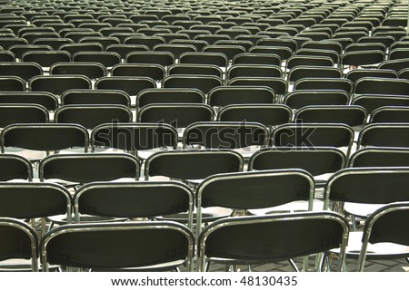 Rows of plastic chairs on an outdoor event
