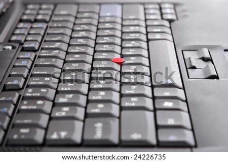 Black keyboard with red joystick and blue enter key