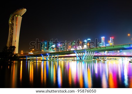 City at night in Singapore,  view of the bridge and the reflection of artificial light