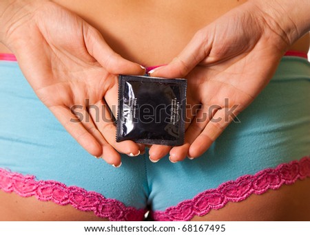 stock photo Closeup of woman panties with condom