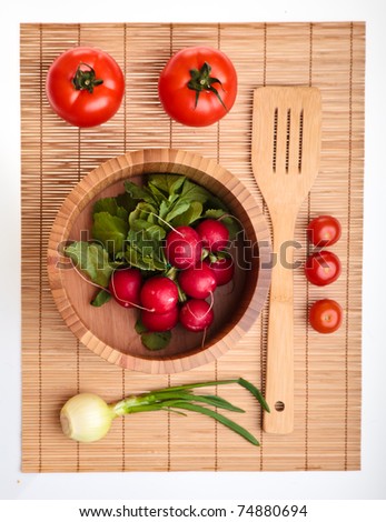 Different ripe vegetables compositions in studio laying on bamboo plate