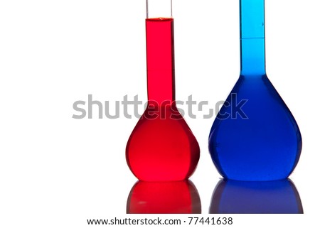 Laboratory glassware with colorful fluids isolated on white