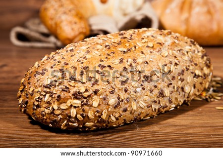 Composition of fresh bread on wood