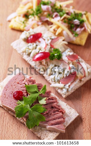 Crisp bread with various savory toppings