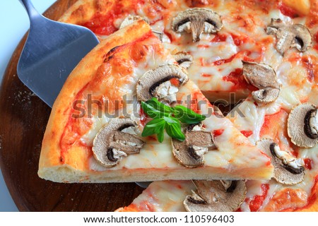 Mushroom pizza on a kitchen board