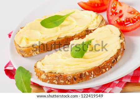 Slices of whole grain bread with butter
