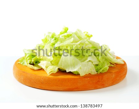 Iceberg lettuce salad on cutting board